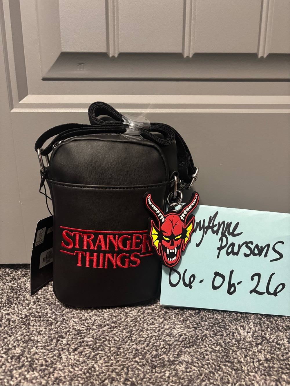 Primark Black Crossbody Bag with Red Stranger Things Logo and Demon Charm